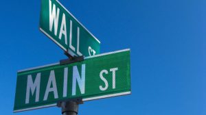 investment management mount kisco ny street sign showing intersection of main street and wall street